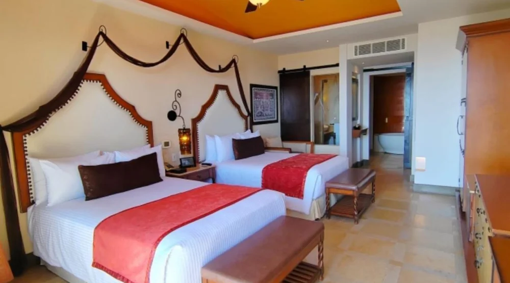 Preferred Club Junior Suite Swimout with Two Double Beds at Secrets Puerto Los Cabos Golf & Spa Resort