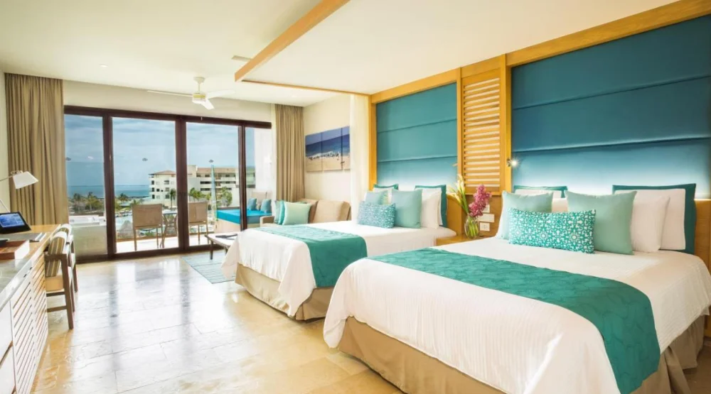 Junior Suite Partial Ocean View - Two Queen Beds at Dreams Playa Mujeres Golf & Spa Resort