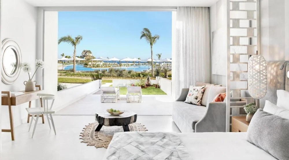 Deluxe Junior Suite with Private Garden and Pool View at Ikos Aria