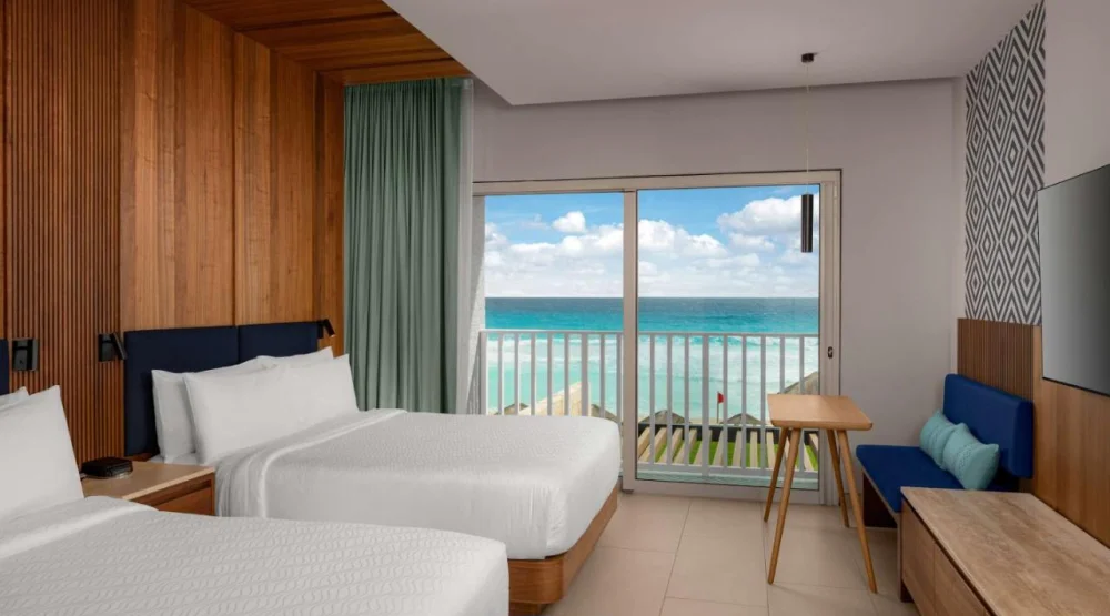 Enclave Beachfront Queen Room with Two Queen Beds and Balcony at Hilton Cancun Mar Caribe All-Inclusive Resort