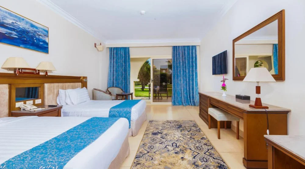 Superior Room Triple Garden View at Serenity Alpha Beach