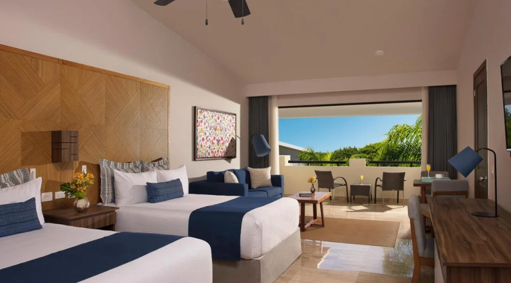 Family Junior Suite Tropical View Triple at Dreams Sapphire Resort & Spa