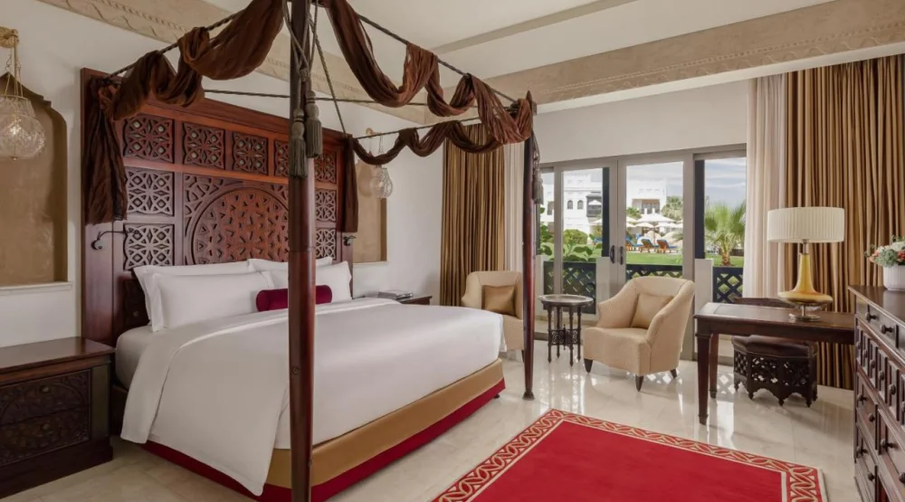 Deluxe Pool View Room, Guest Room, One King at Sharq Village & Spa a Ritz-Carlton Hotel