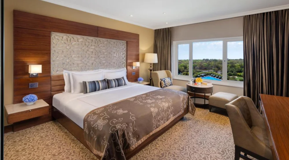 Taj Club Room King Bed Forest and Pool View at Taj Palace New Delhi