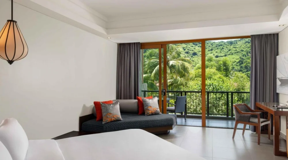 Grand King Room with Balcony and Garden View at Angsana Lang Co