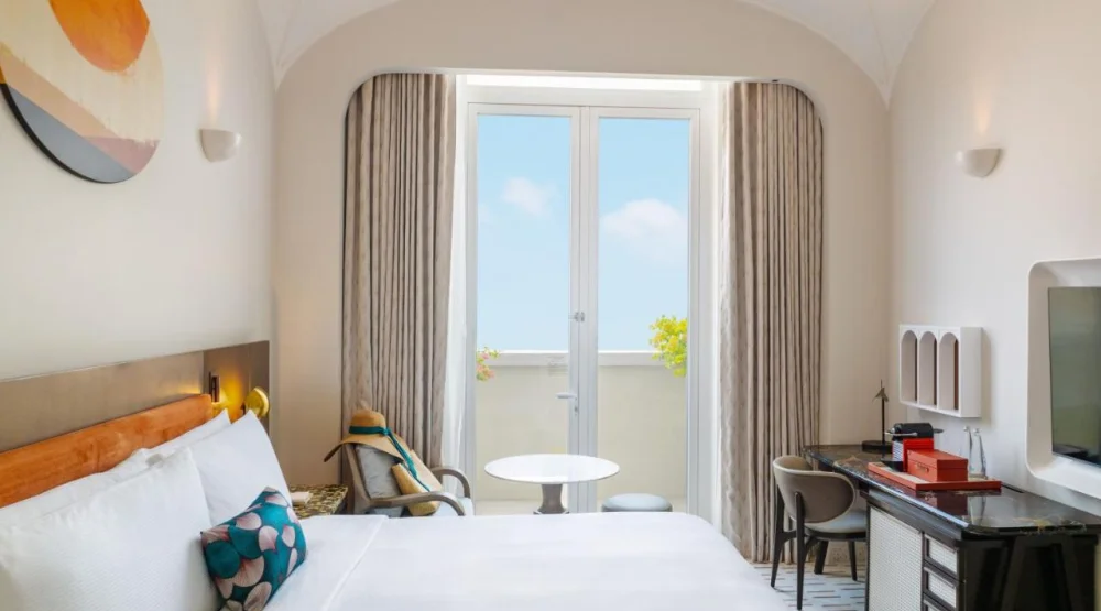 King Room with Balcony at La Festa Phu Quoc Curio Collection By Hilton