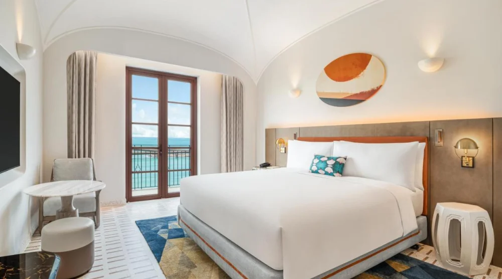 King Room with Balcony and Ocean View at La Festa Phu Quoc Curio Collection By Hilton