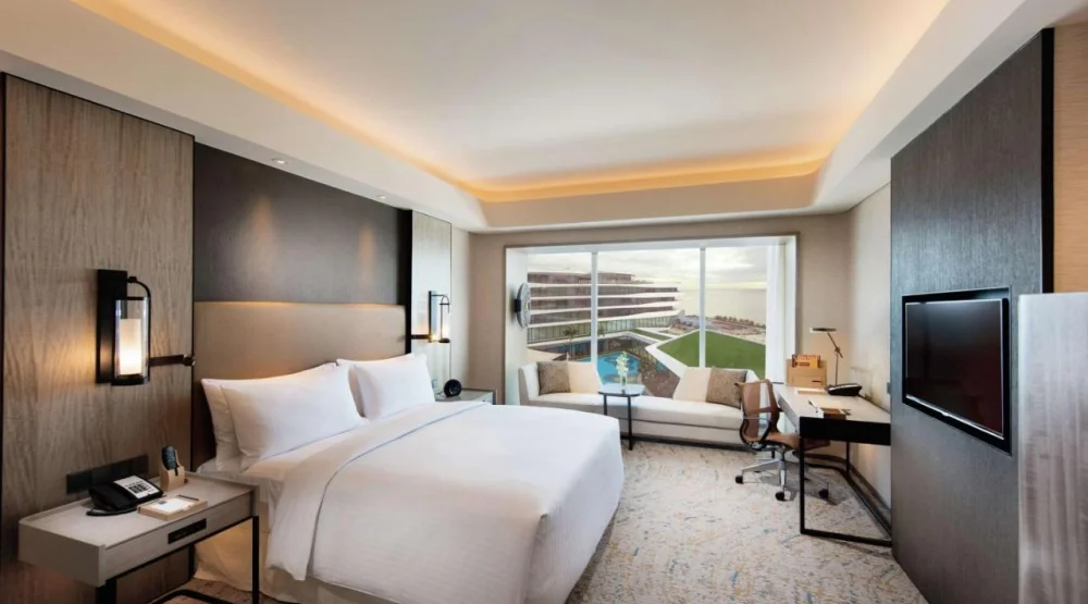Deluxe King Room with Pool View and Partial Bay View at Conrad Manila