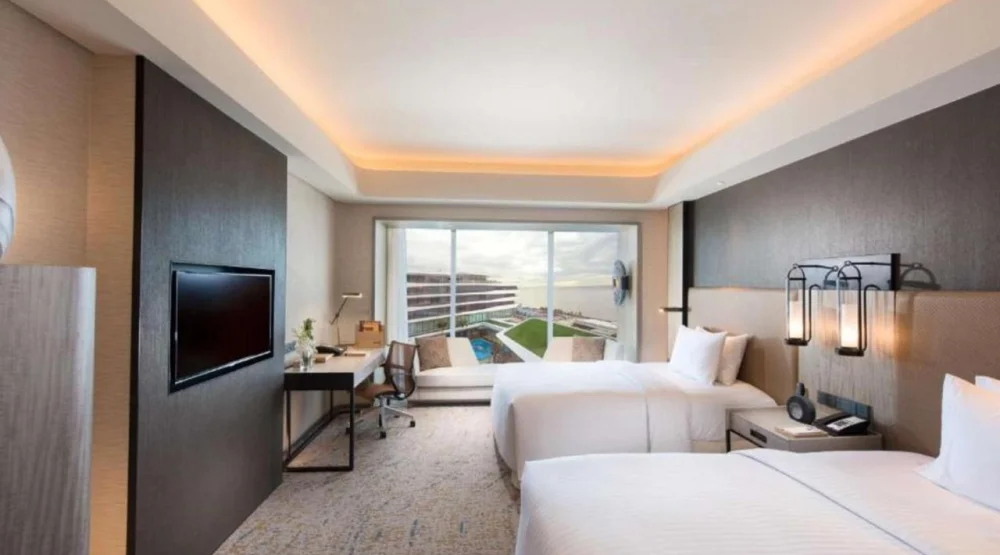 Deluxe Twin Room with Pool View and Partial Bay View at Conrad Manila