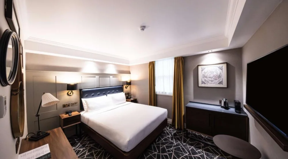 Cozy Atrium Room at 100 Queen's Gate Hotel London, Curio Collection by Hilton